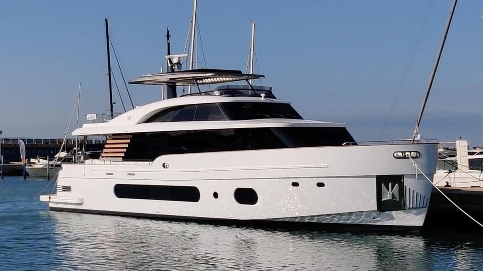 a white yacht in the water aboard KIKI Yacht for Sale