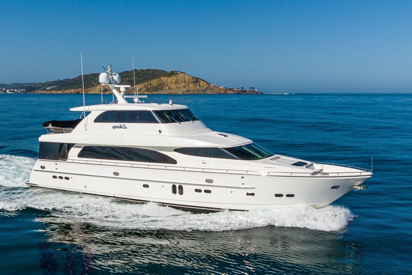 a white yacht on the water aboard LIBERTY Yacht for Sale