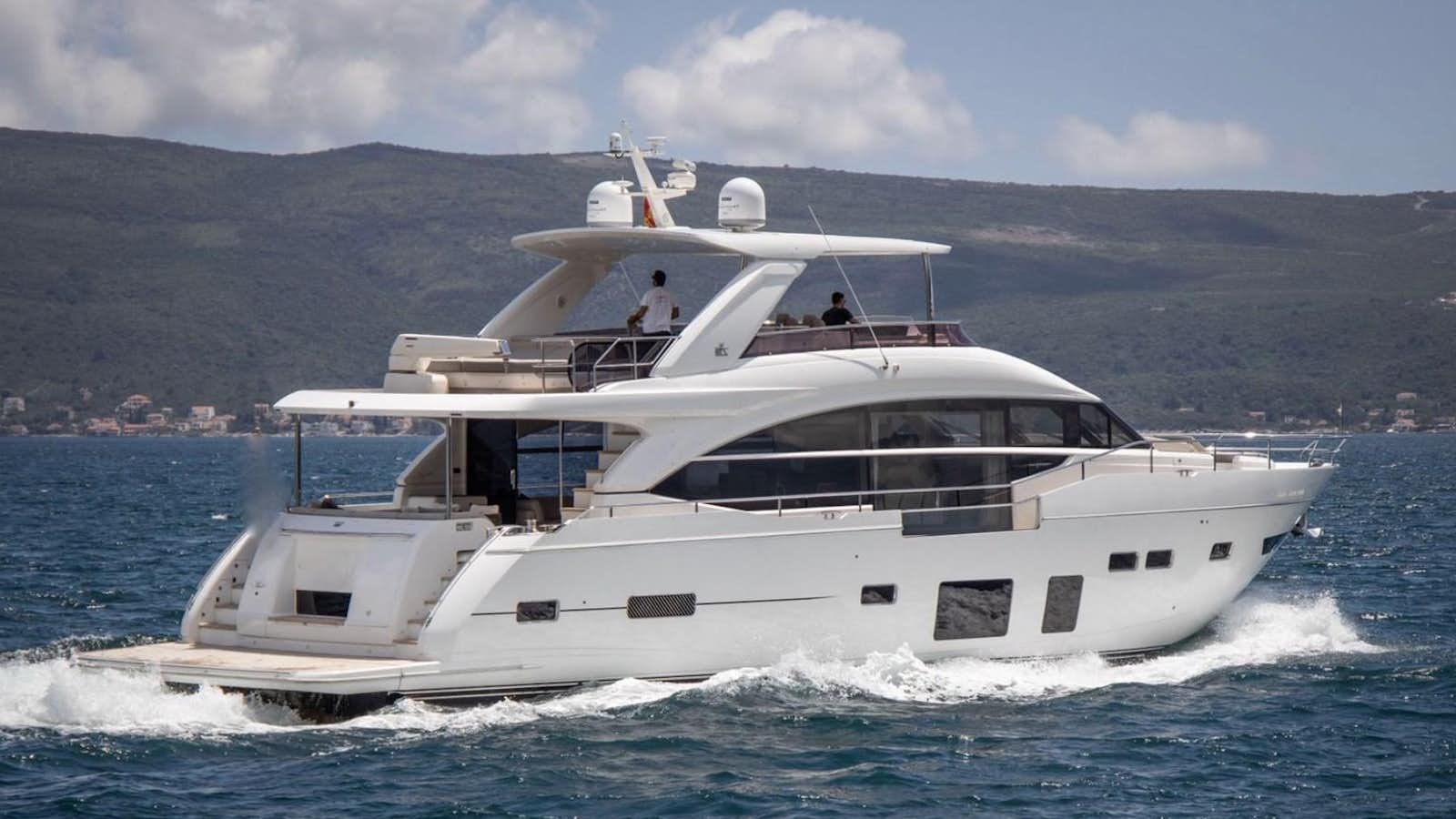 a white yacht on the water aboard XM Yacht for Sale