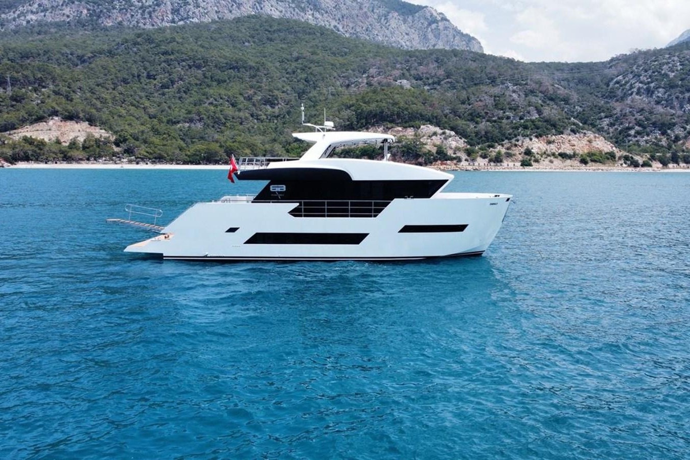 a white yacht in the water aboard CARBOYACHT 68 Yacht for Sale
