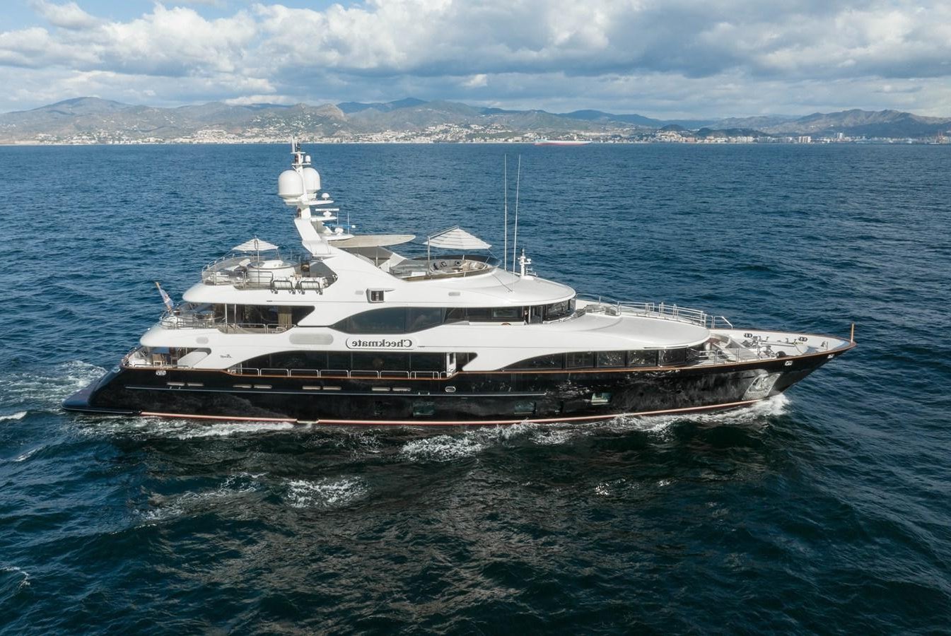 a large boat in the water aboard CHECKMATE Yacht for Sale