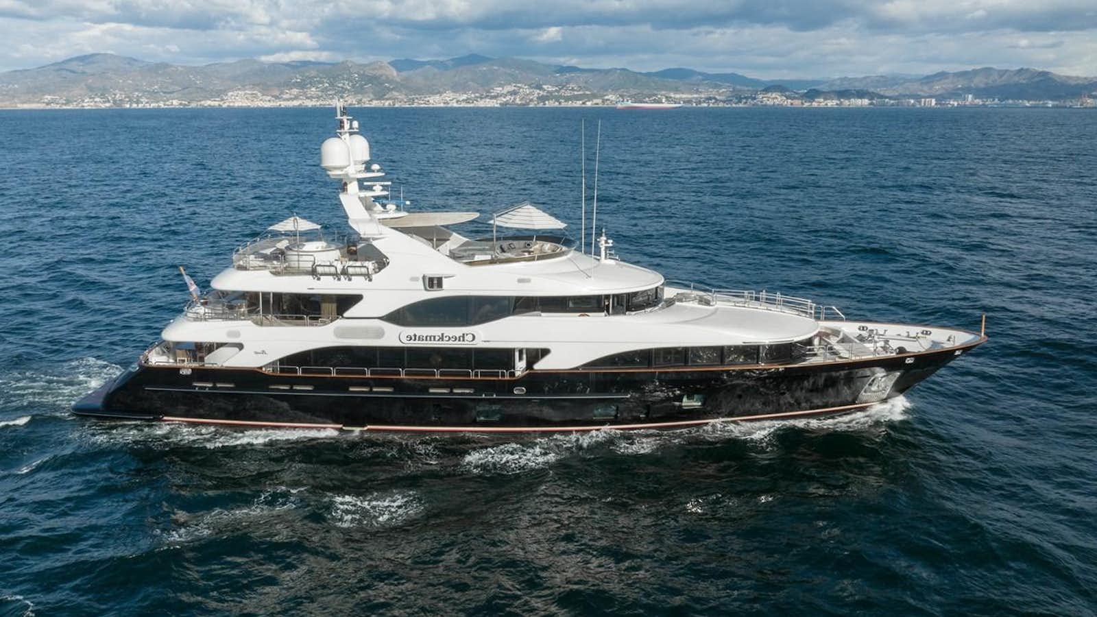 a large boat in the water aboard CHECKMATE Yacht for Sale