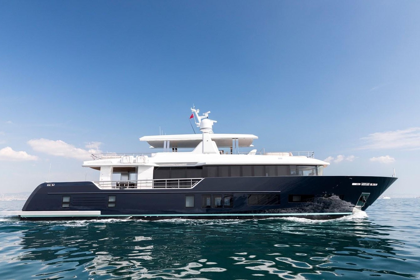 a large boat in the water aboard PICCOLO @ FLIBS Yacht for Sale