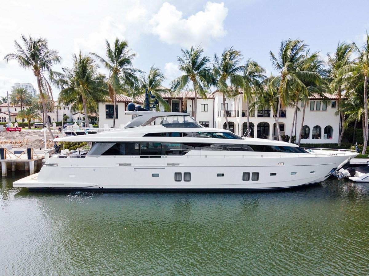 a white yacht docked at a dock aboard NOTORIOUS Yacht for Sale
