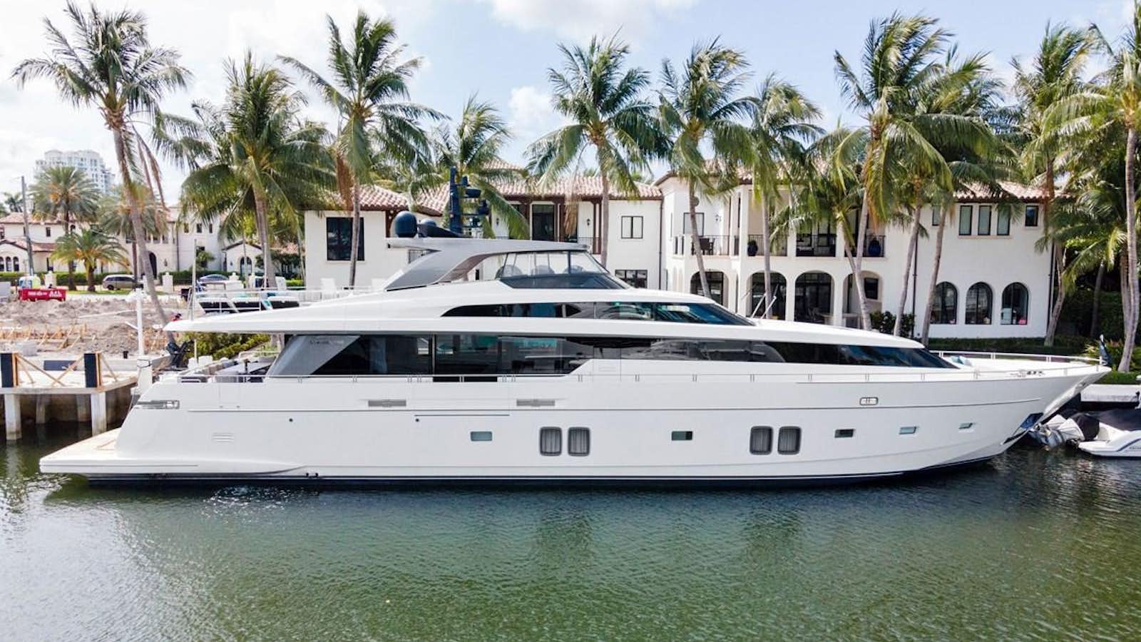 a white yacht docked at a dock aboard NOTORIOUS Yacht for Sale