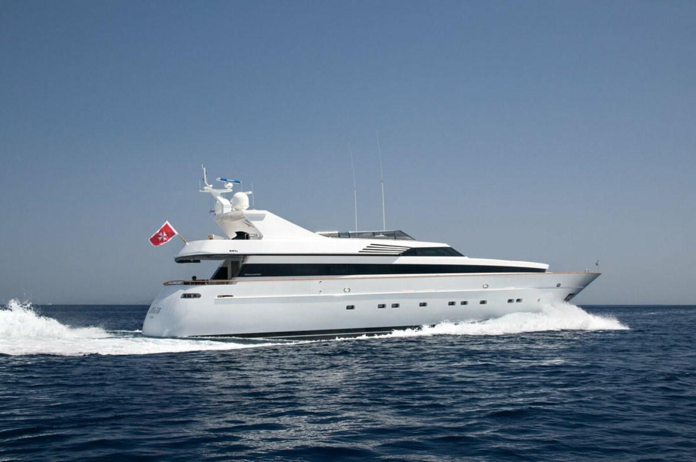 a white yacht in the water aboard REGINA K Yacht for Sale