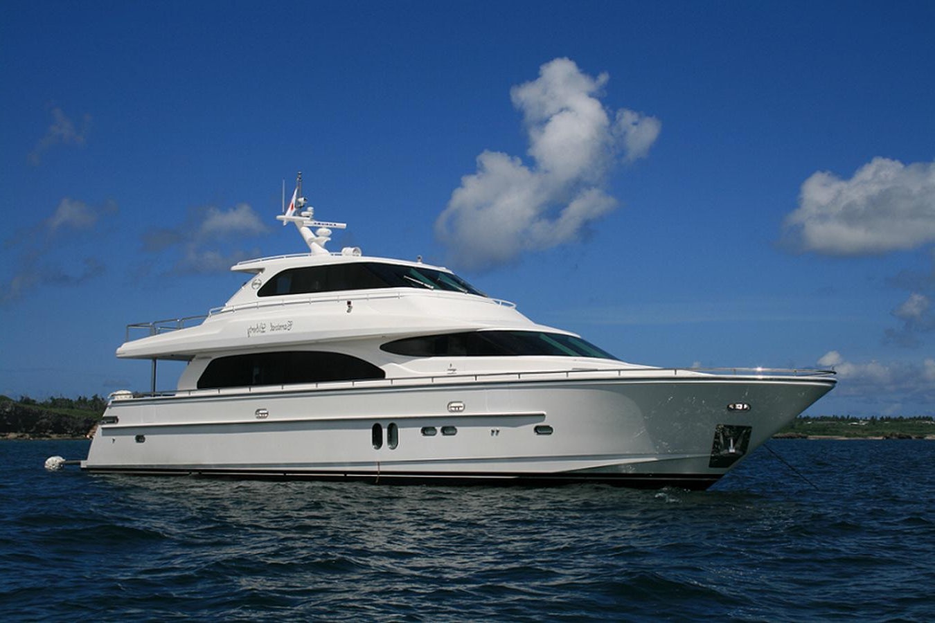 a white yacht on the water aboard ANA Yacht for Sale