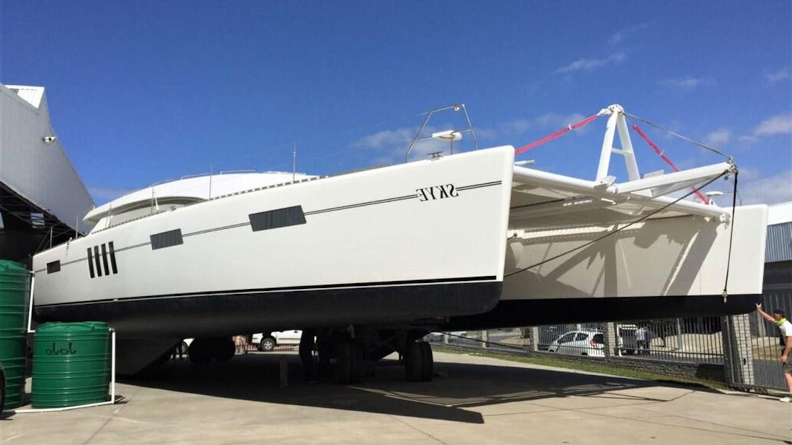 a white boat on a trailer aboard SKYE Yacht for Sale