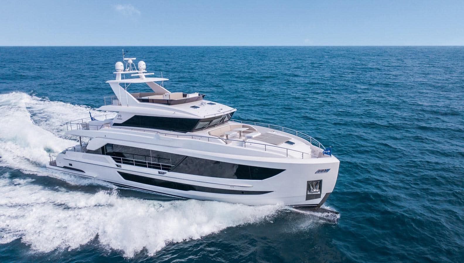 a white yacht on the water aboard HORIZON FD110 Yacht for Sale