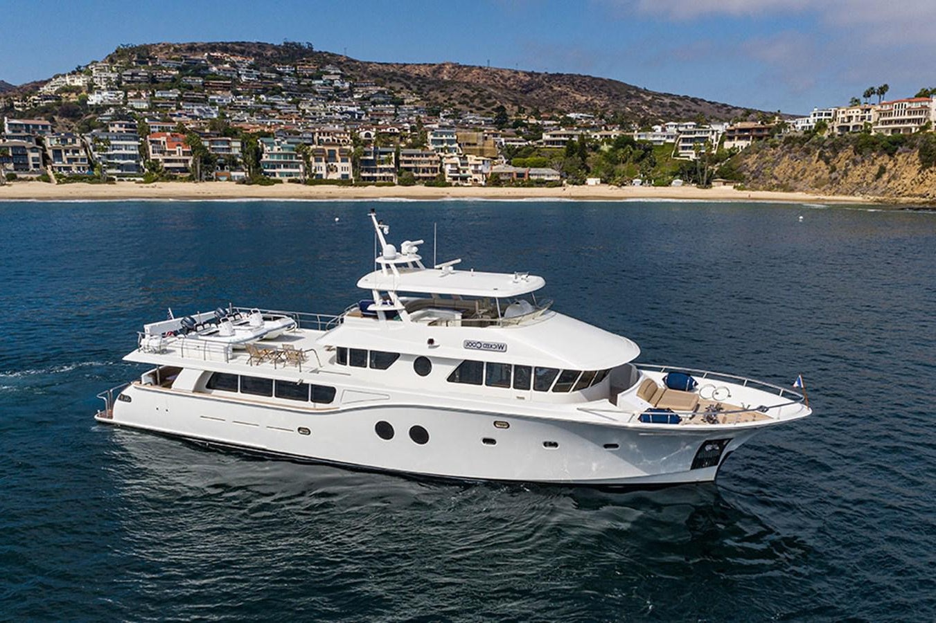 a white yacht in the water aboard WICKED COOL Yacht for Sale