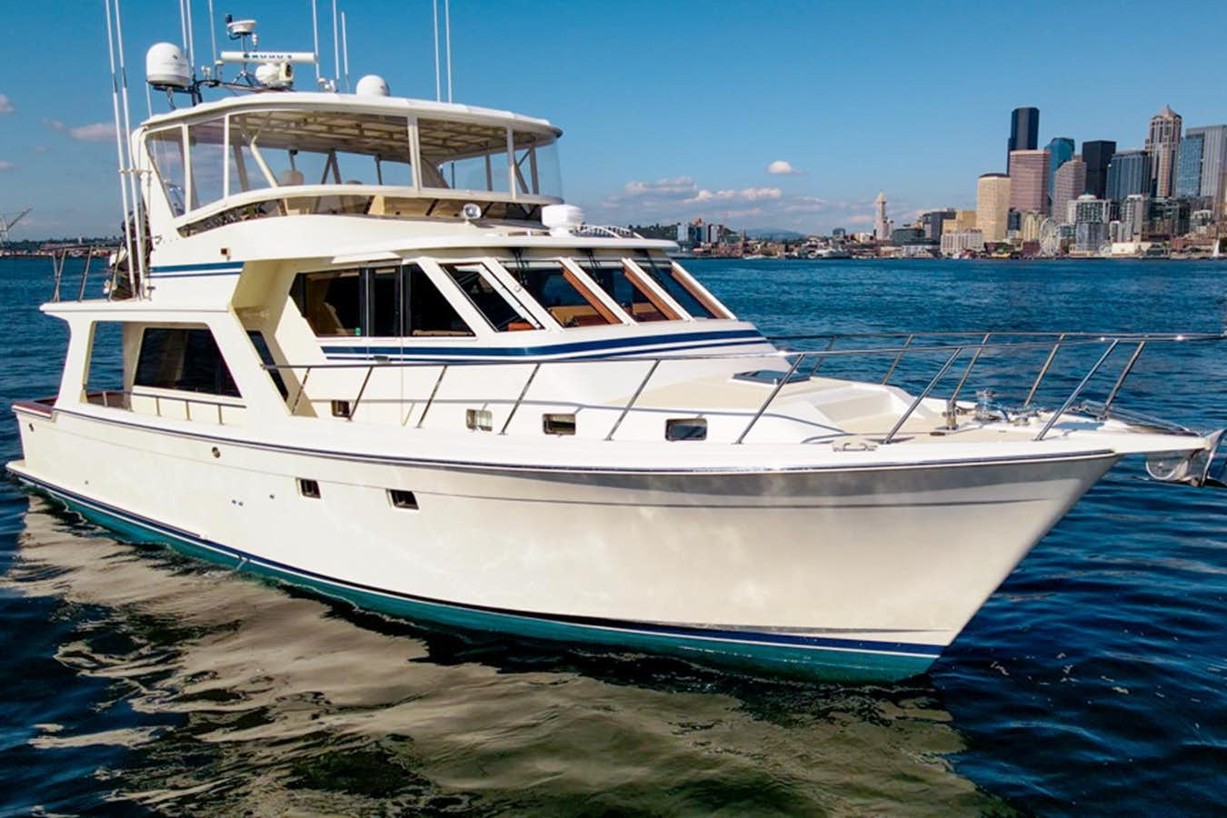 a white yacht on a beach aboard SIERRA FOX Yacht for Sale