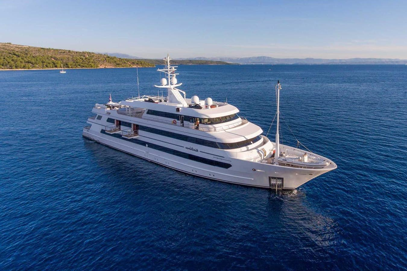 a large white boat in the water aboard KATINA Yacht for Sale