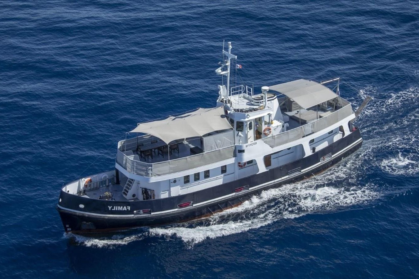 a large ship on the water aboard FAMILY Yacht for Sale