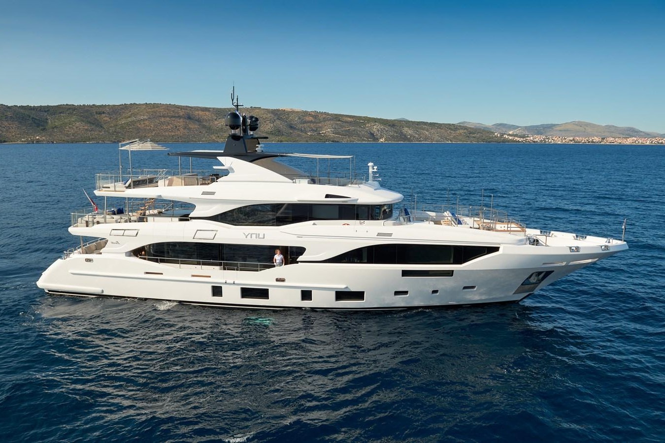 a white yacht in the water aboard UNY Yacht for Sale