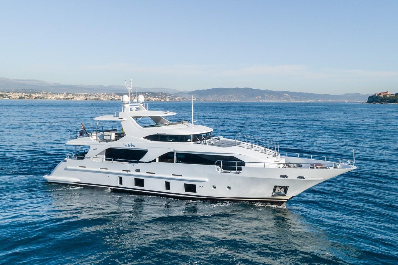 a white yacht in the water aboard ADEL Yacht for Sale