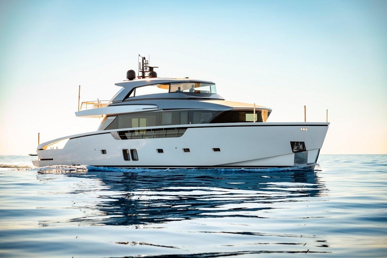 a white yacht on the water aboard LA SX88 Yacht for Sale