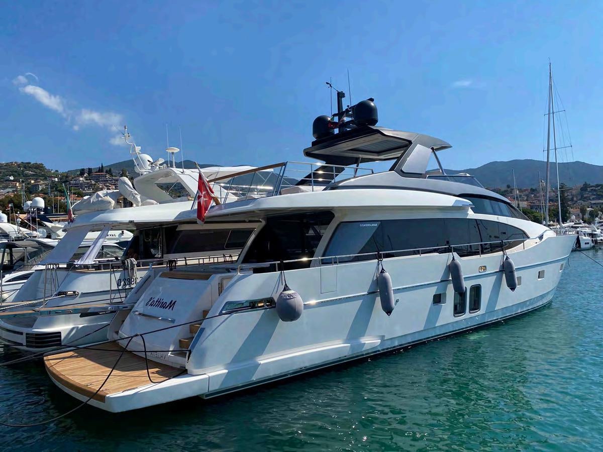 a couple of boats are parked in the water aboard MARITTA’S Yacht for Sale