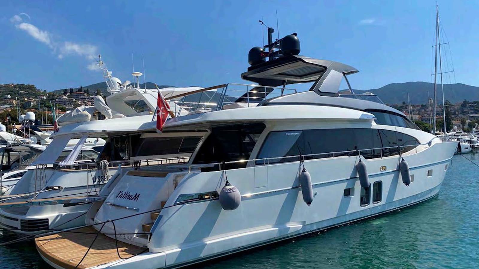 a couple of boats are parked in the water aboard MARITTA’S Yacht for Sale