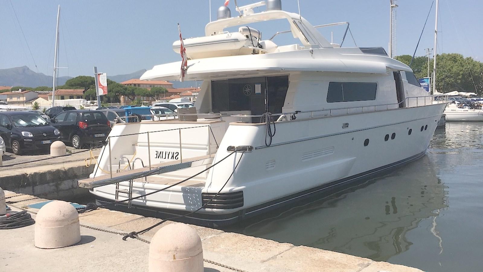 a white boat docked aboard SKYLINE Yacht for Sale