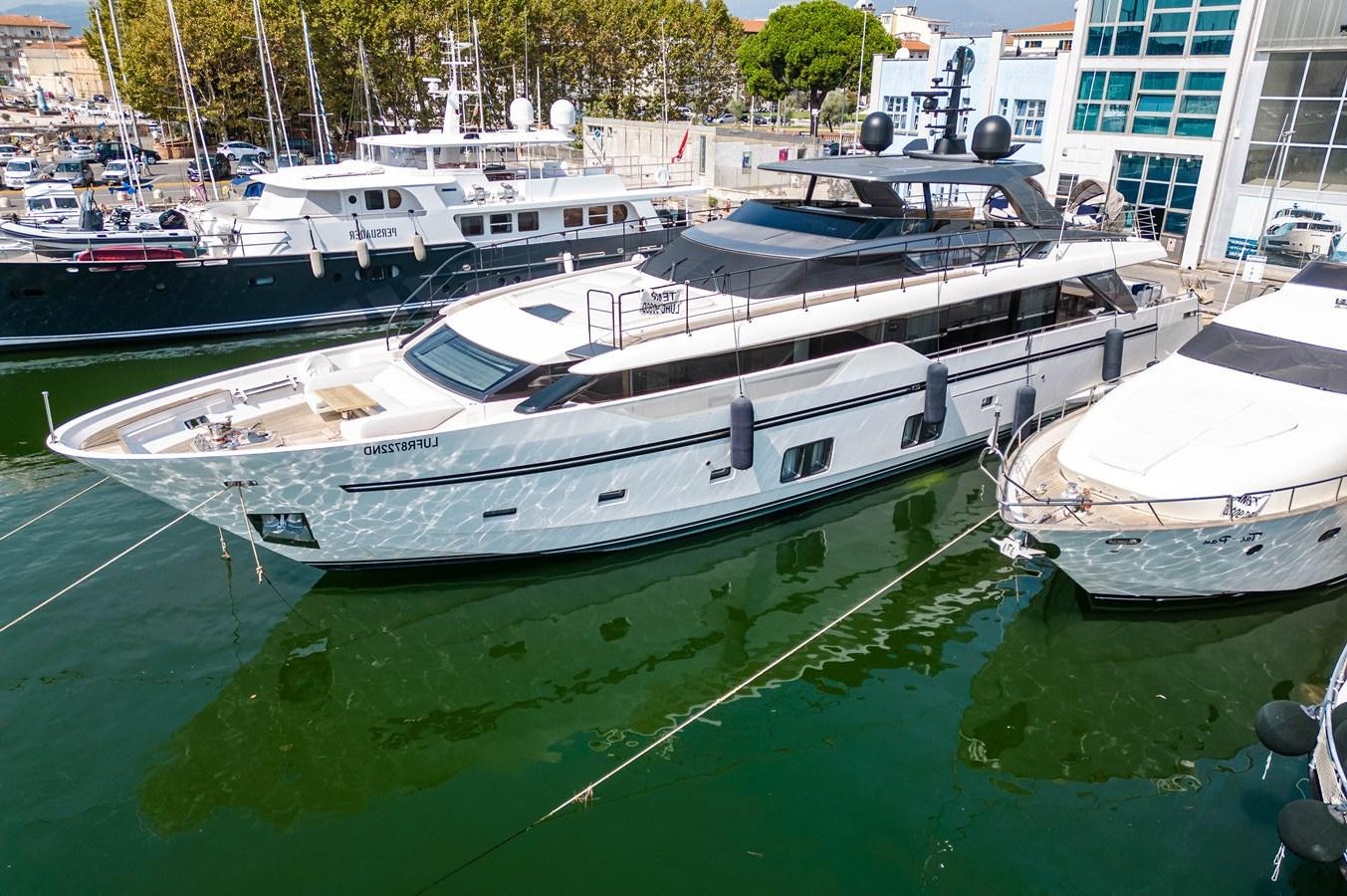 a group of boats are parked in a harbor aboard VISSOTTA Yacht for Sale