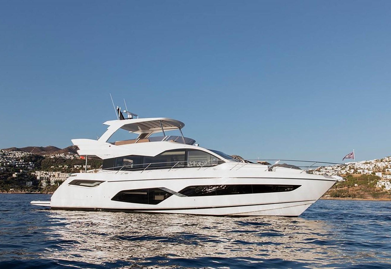 a white yacht on the water aboard SUNSEEKER 70' MANHATTAN Yacht for Sale