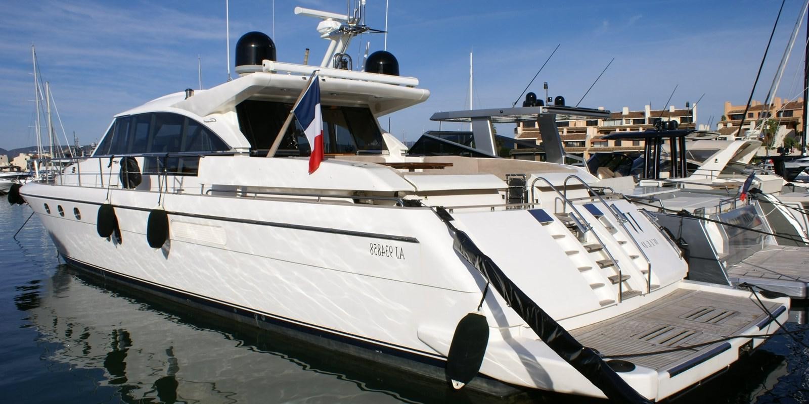a boat docked at a pier aboard WILD Yacht for Sale