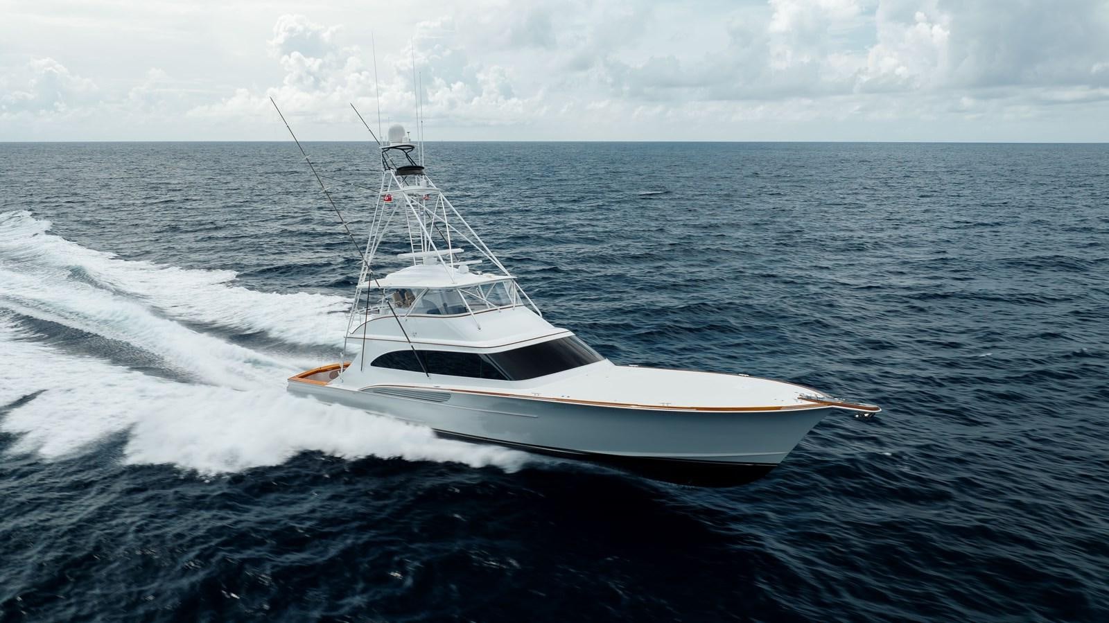 a white boat on the water aboard JARUCO Yacht for Sale