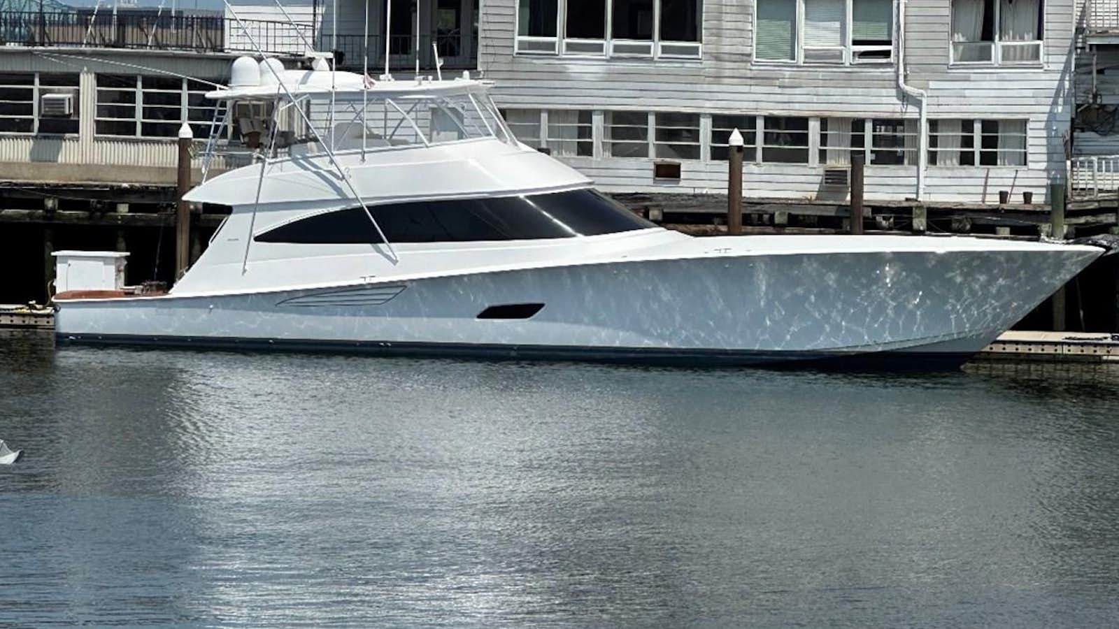 a white yacht docked aboard KEMOSABE Yacht for Sale