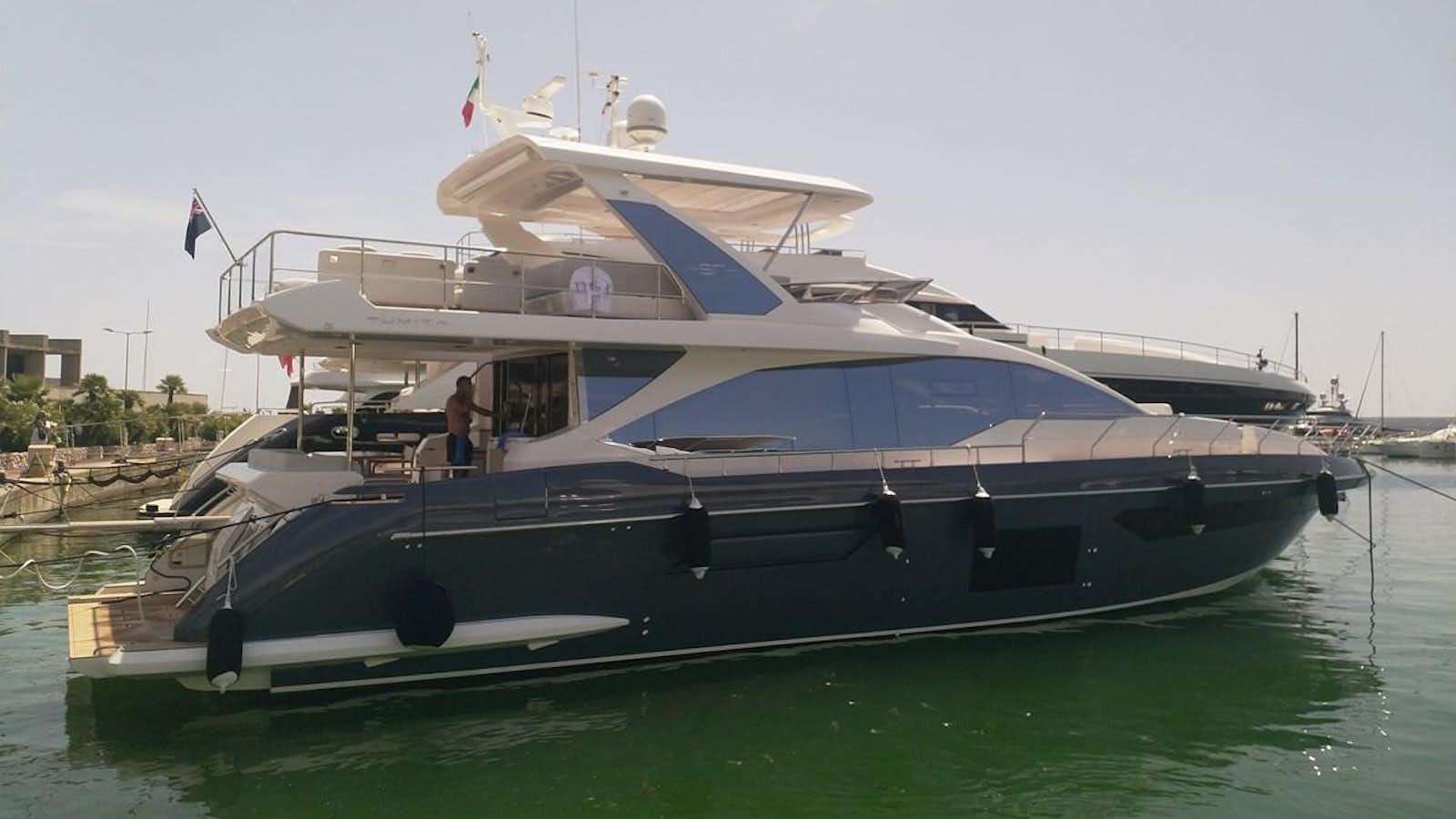 a boat docked at a pier aboard BLUE Yacht for Sale
