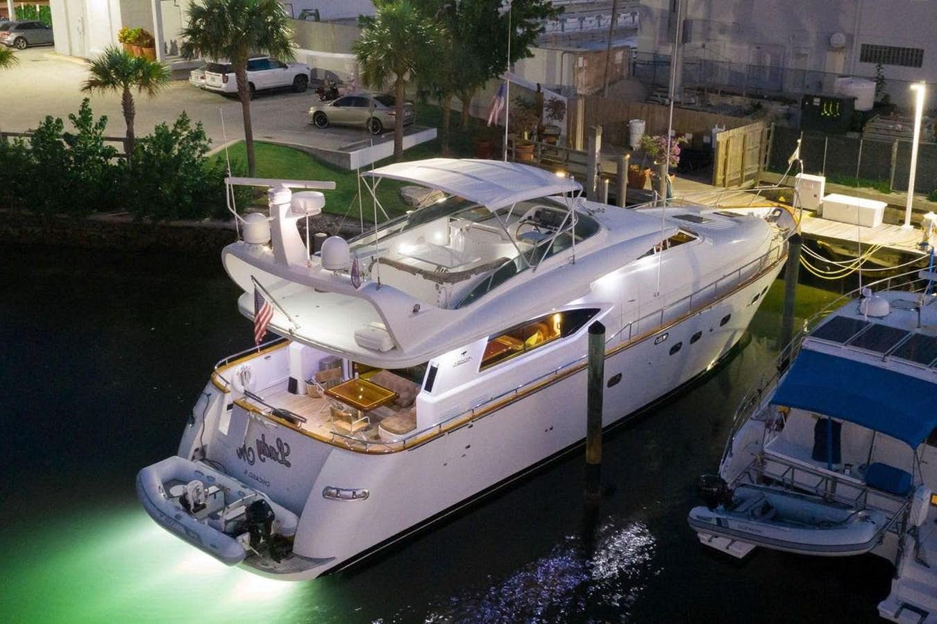 a boat docked at a pier aboard 1997 MAIORA FIPA 70' FLYBRIDGE Yacht for Sale
