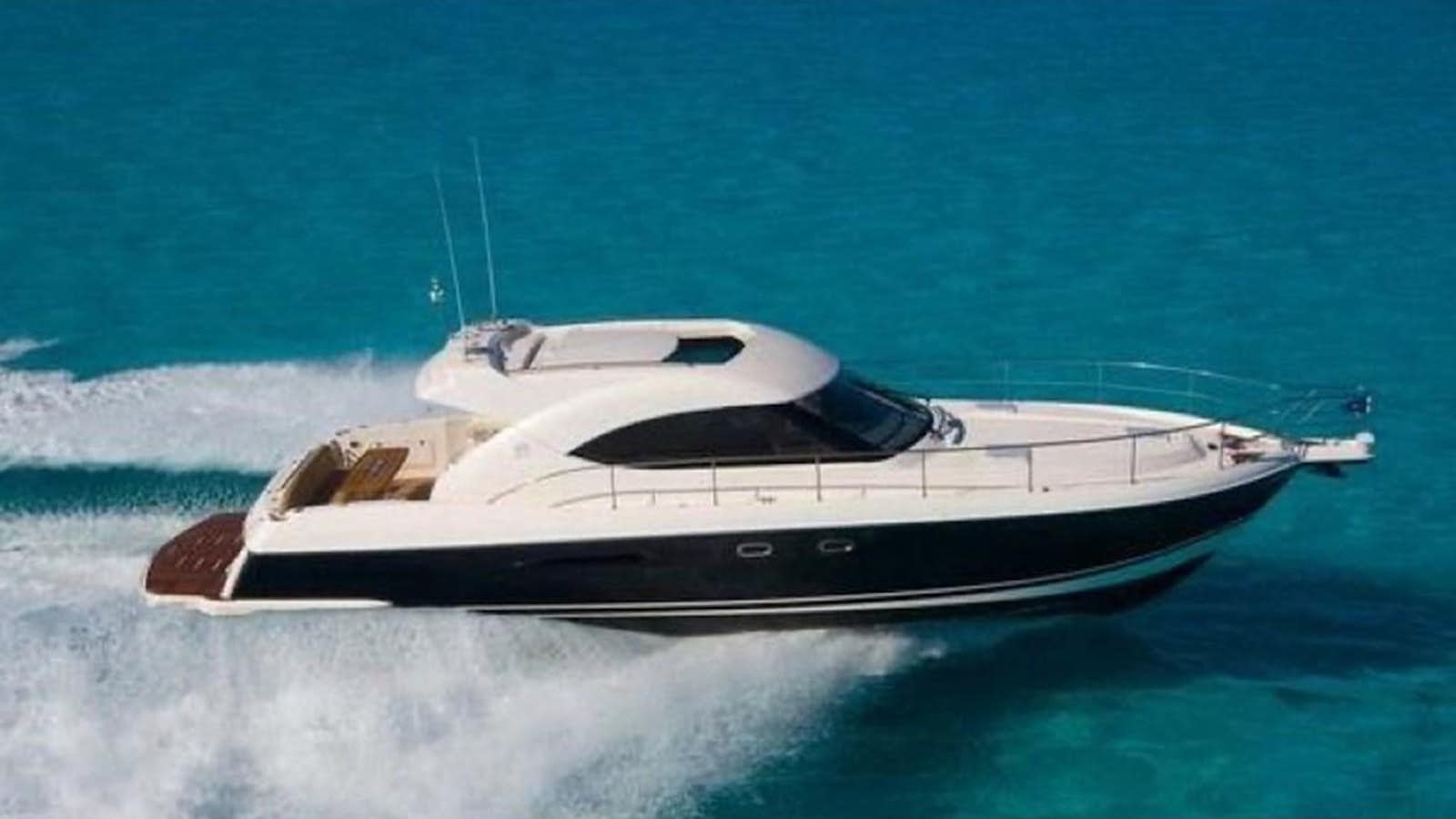 a boat on the water aboard 2009 RIVIERA 4700 SPORT Yacht for Sale