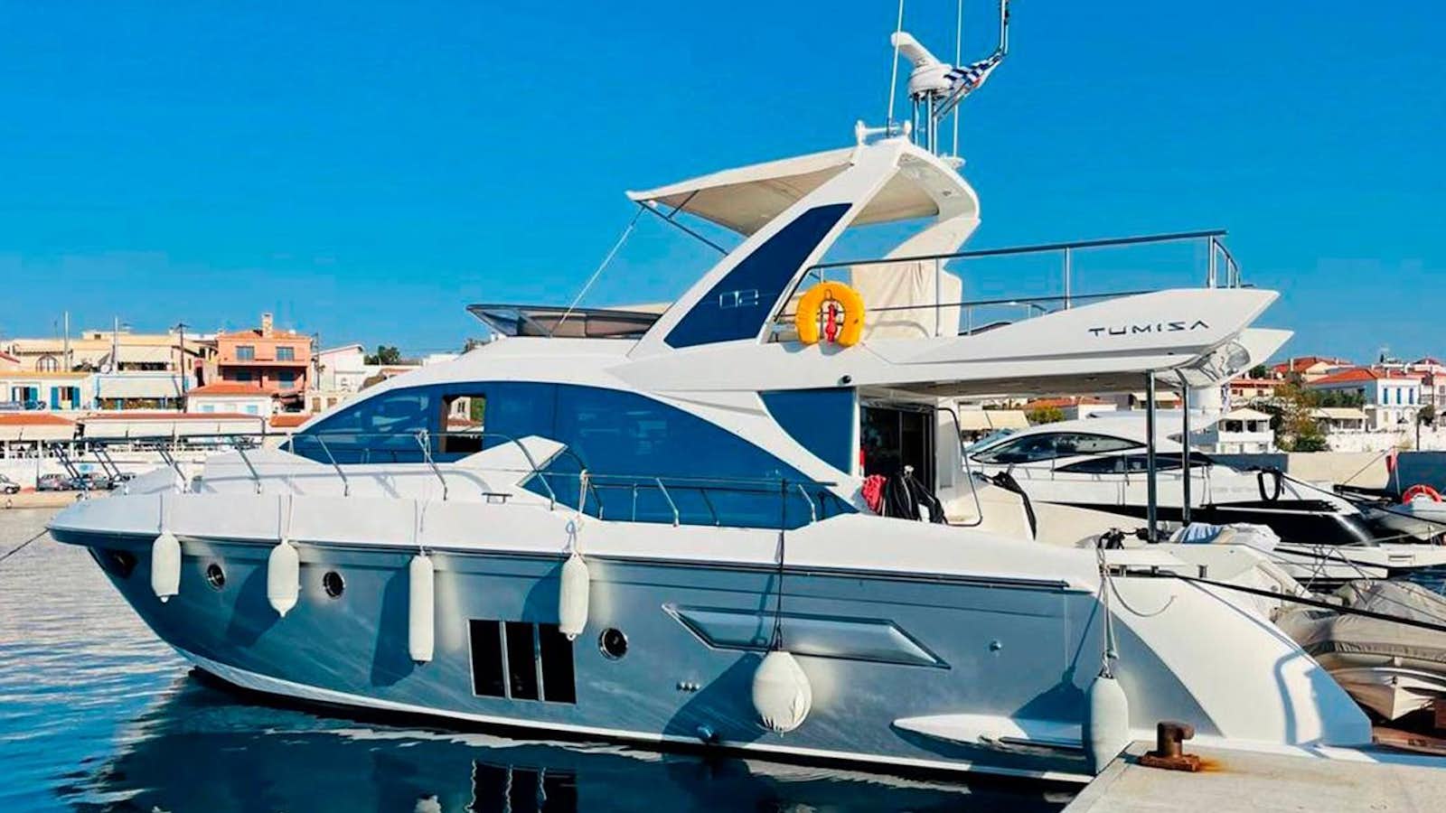 a boat docked at a pier aboard VIKA Yacht for Sale