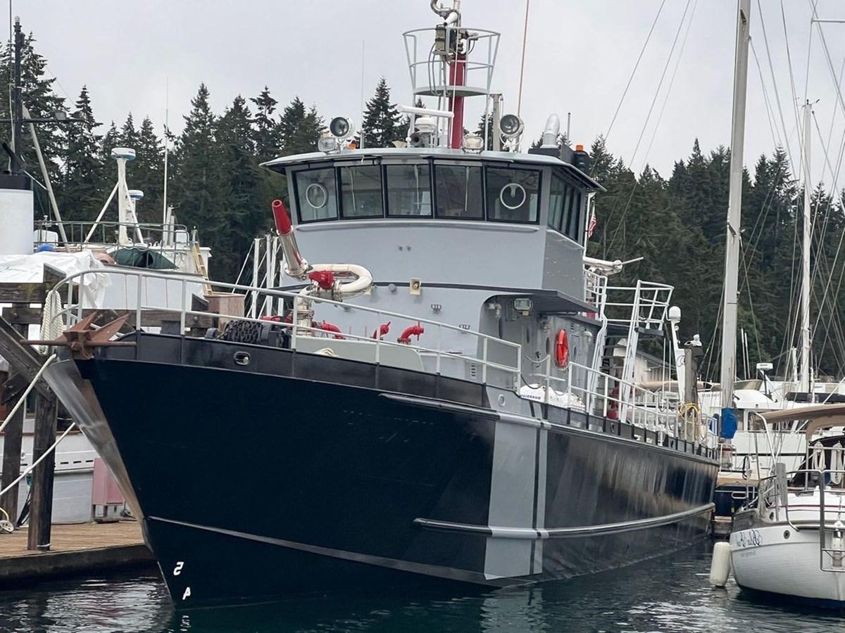 a boat docked at a pier aboard 1989 COMMERCIAL FIREBOAT Yacht for Sale