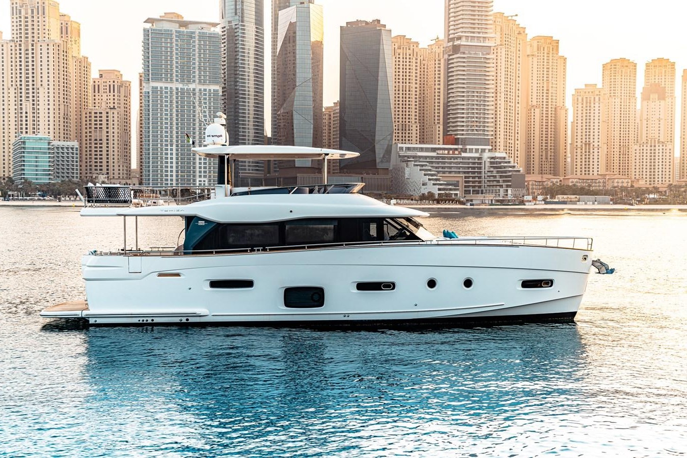 a white yacht in the water aboard FAT BOY Yacht for Sale