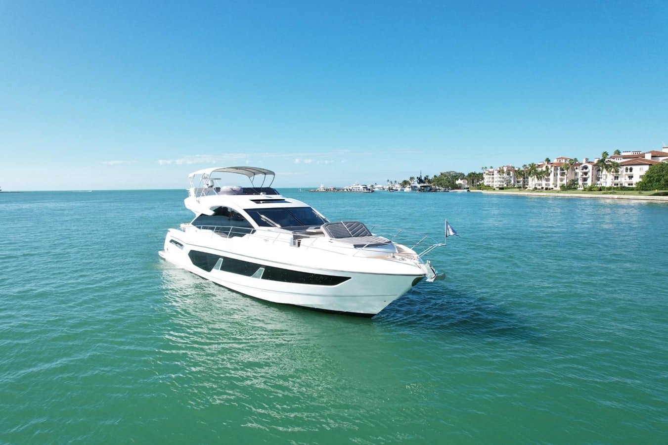 a white yacht in the water aboard HIDE OUT Yacht for Sale