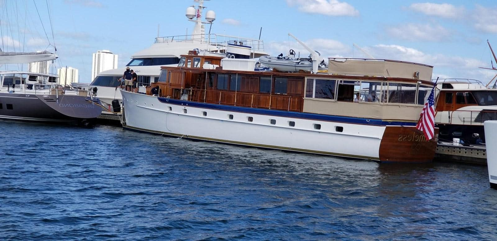 a large boat in the water aboard TIMELESS Yacht for Sale