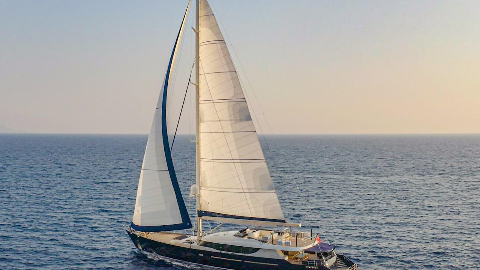 a sailboat in the water aboard L'AQUILA Yacht for Sale