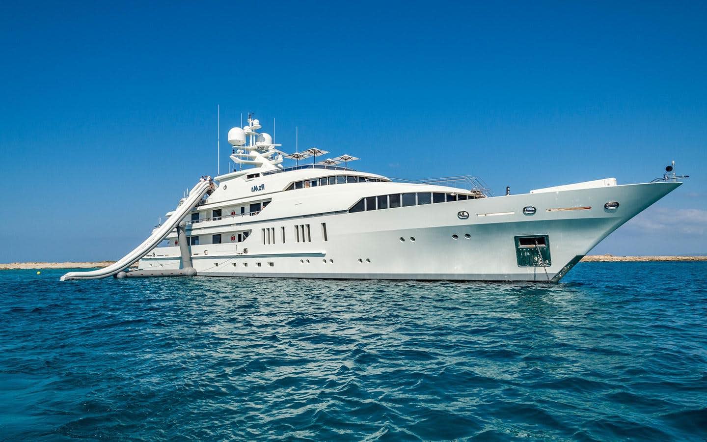 a white yacht in the water aboard ROMA Yacht for Sale