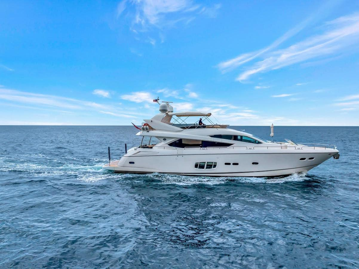 a white yacht in the water aboard QUATTRO Yacht for Sale