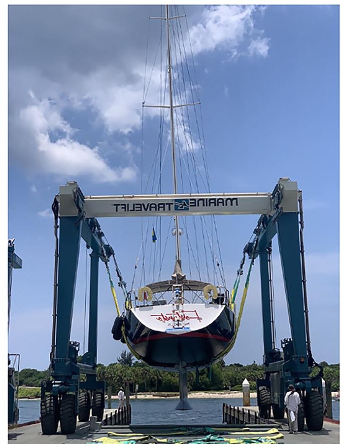 a large crane with a boat on it aboard FORTUNATO Yacht for Sale