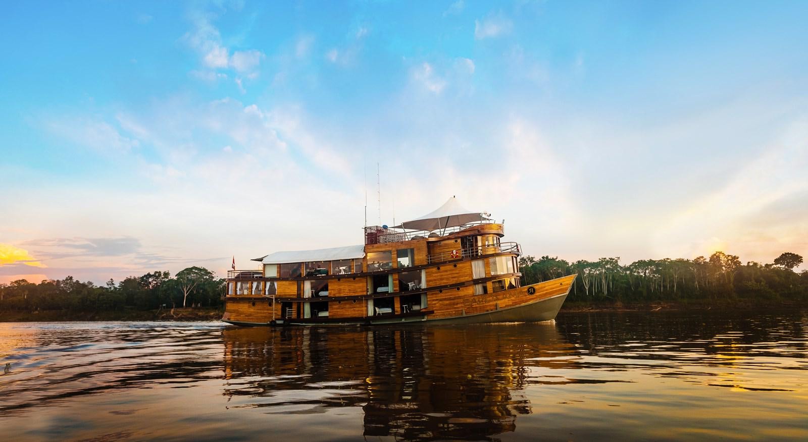 a boat on the water aboard CRUCERO AMAZONAS Yacht for Sale