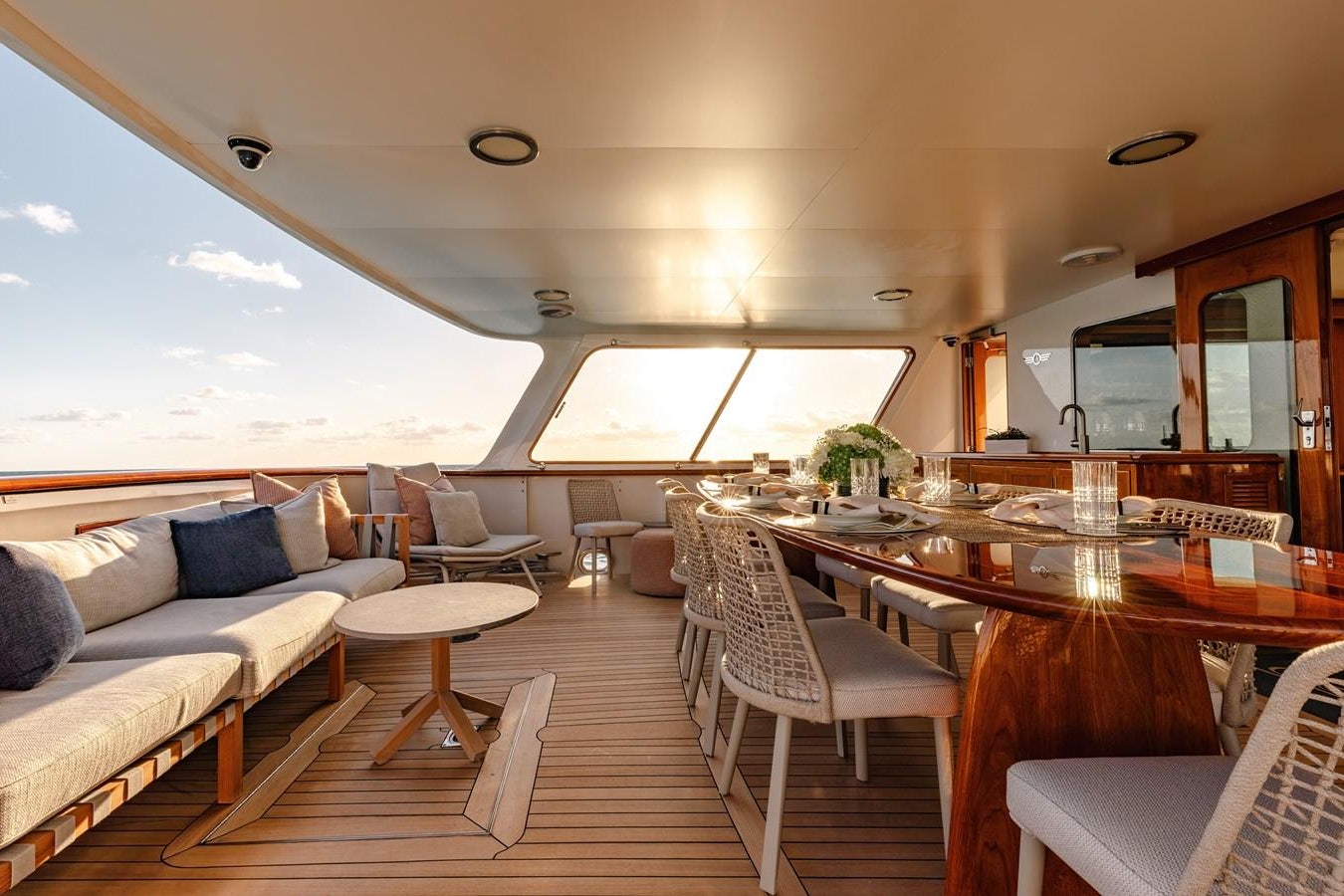 a boat with a table and chairs aboard CALYPSO Yacht for Sale