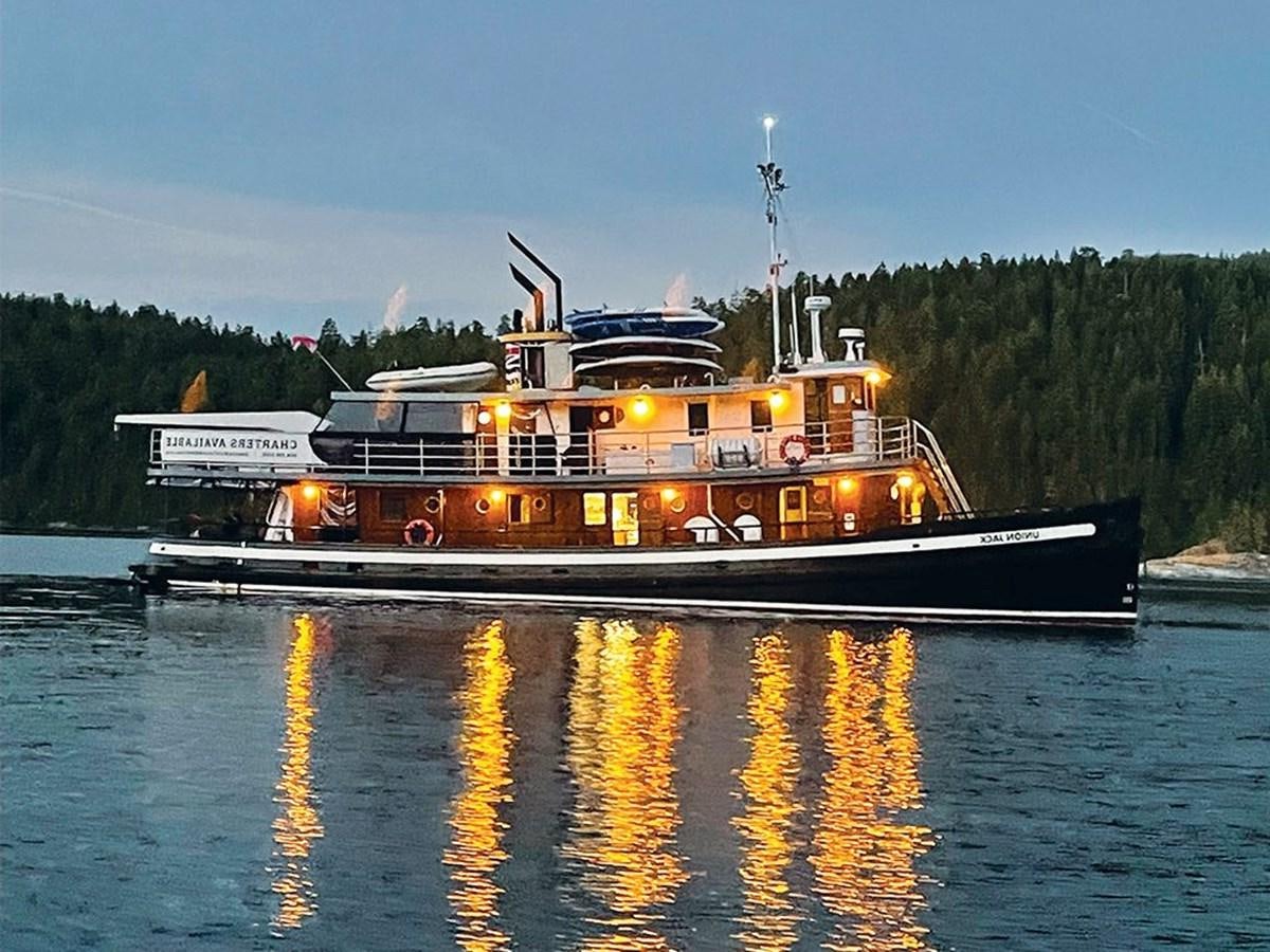 a boat on the water aboard M/V UNION JACK 80 HERITAGE TUG Yacht for Sale