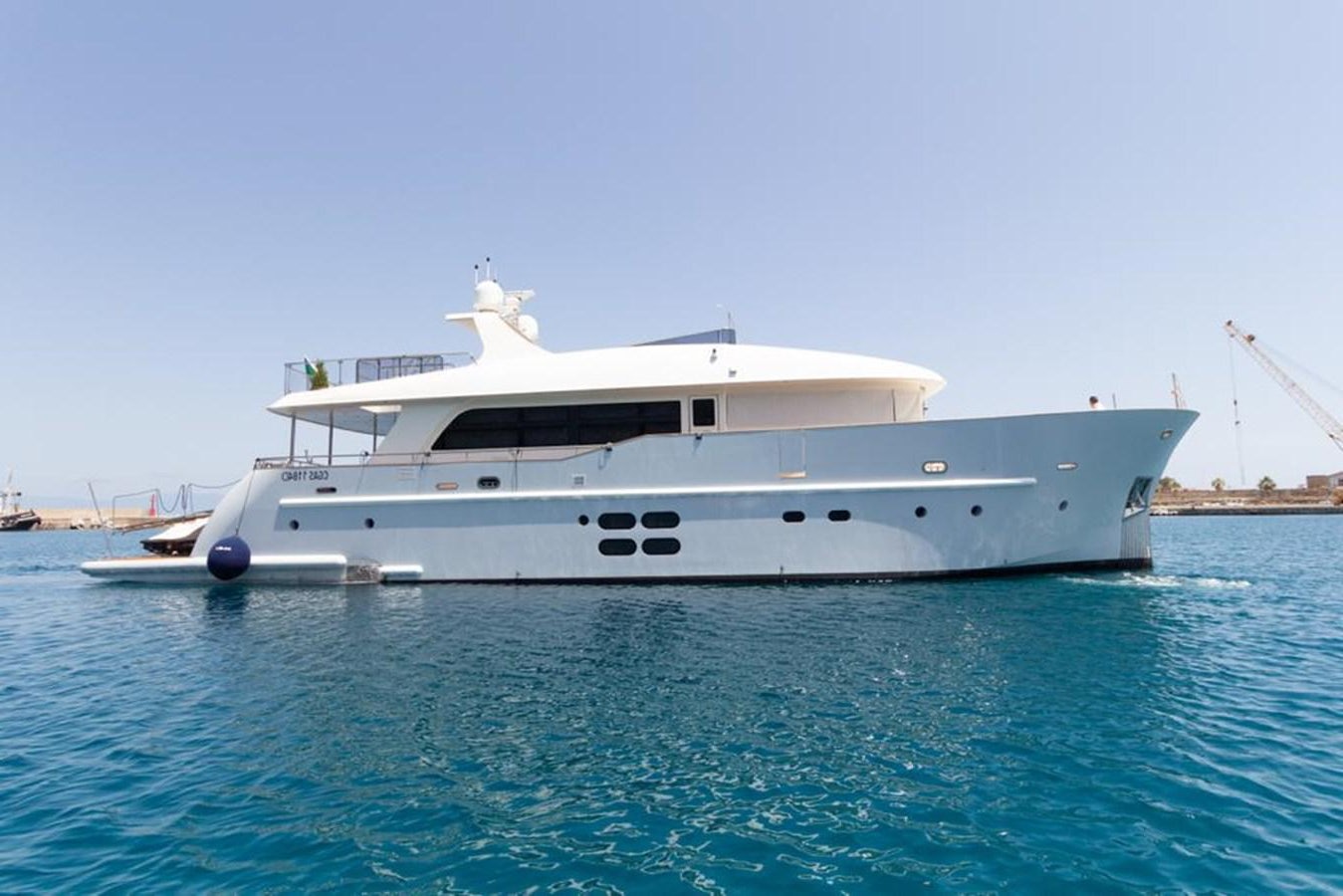 a white boat in the water aboard MR GU Yacht for Sale