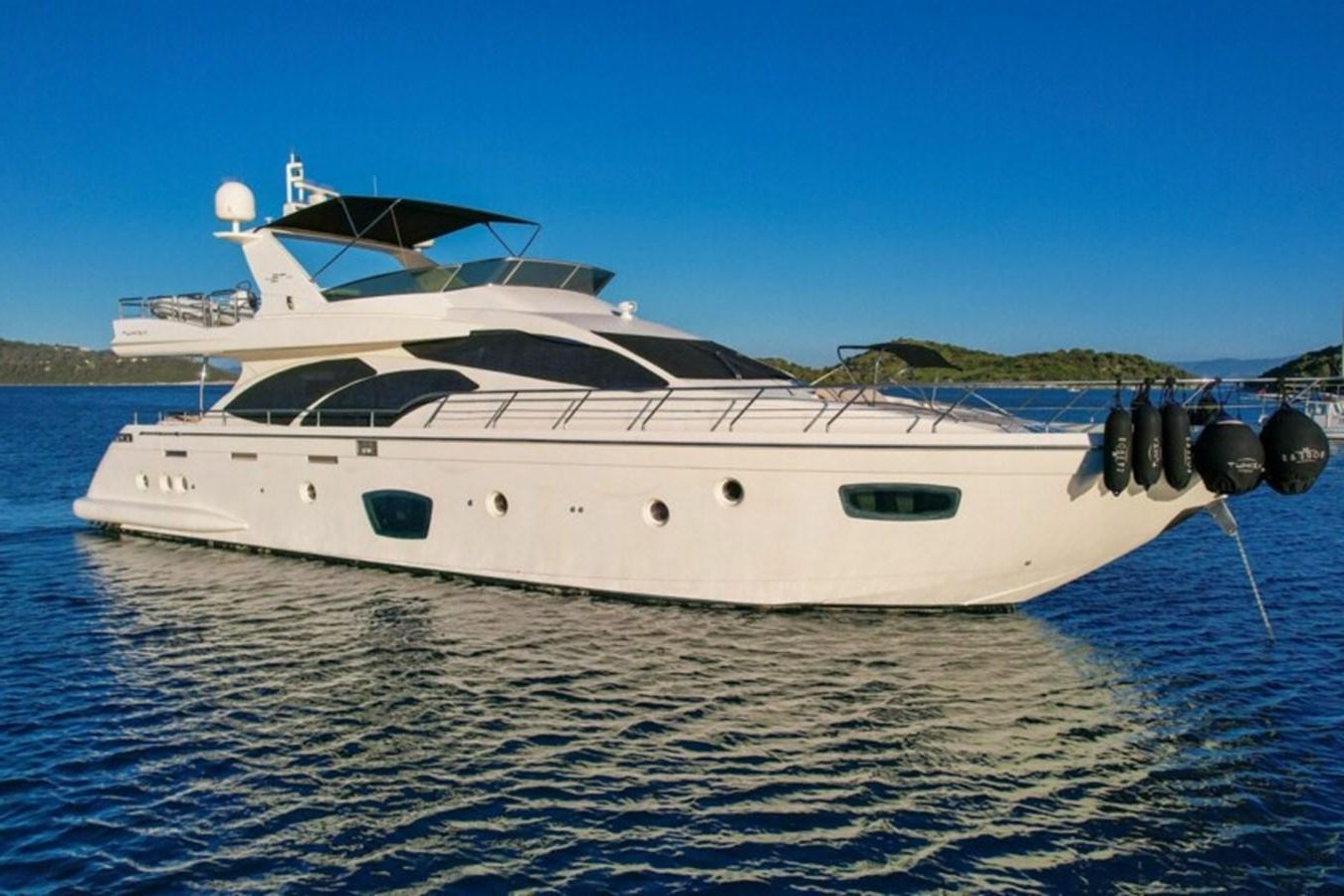 a white yacht on the water aboard C Yacht for Sale