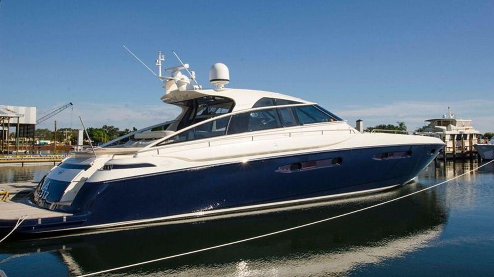 a white yacht docked aboard DIVINE MADNESS Yacht for Sale