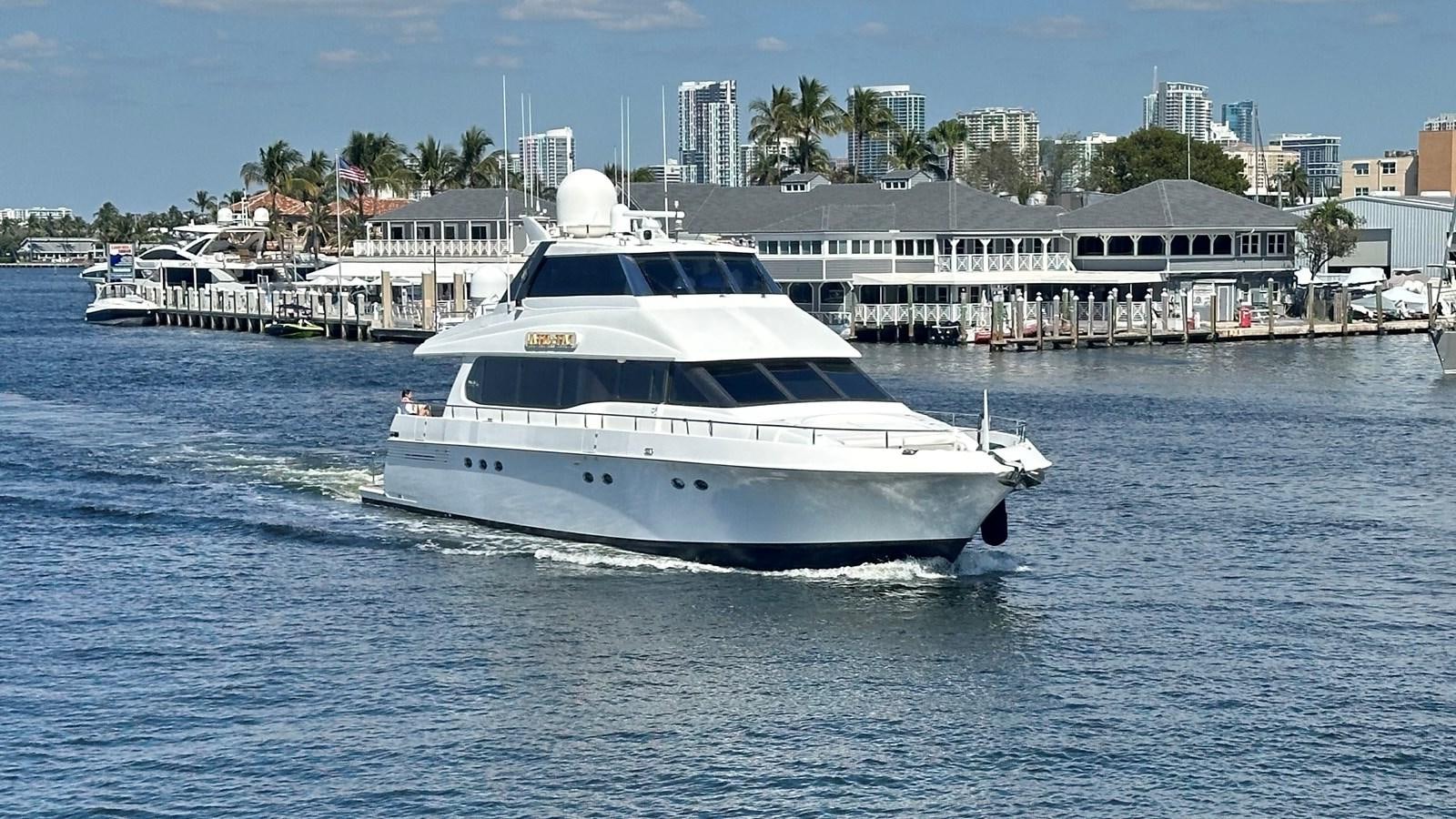 a white boat on the water aboard DARE TO DREAM Yacht for Sale