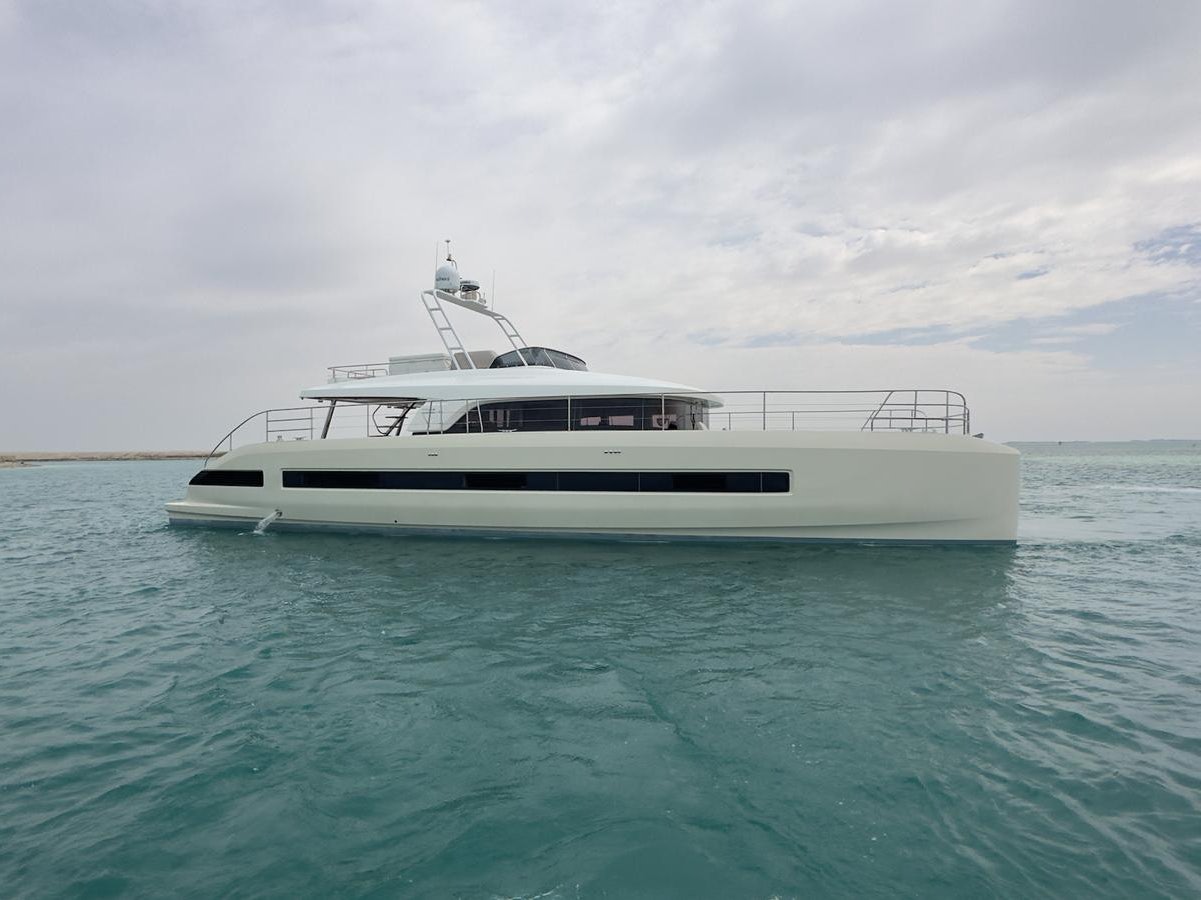 a white boat in the water aboard 2023 LAGOON 67 Yacht for Sale