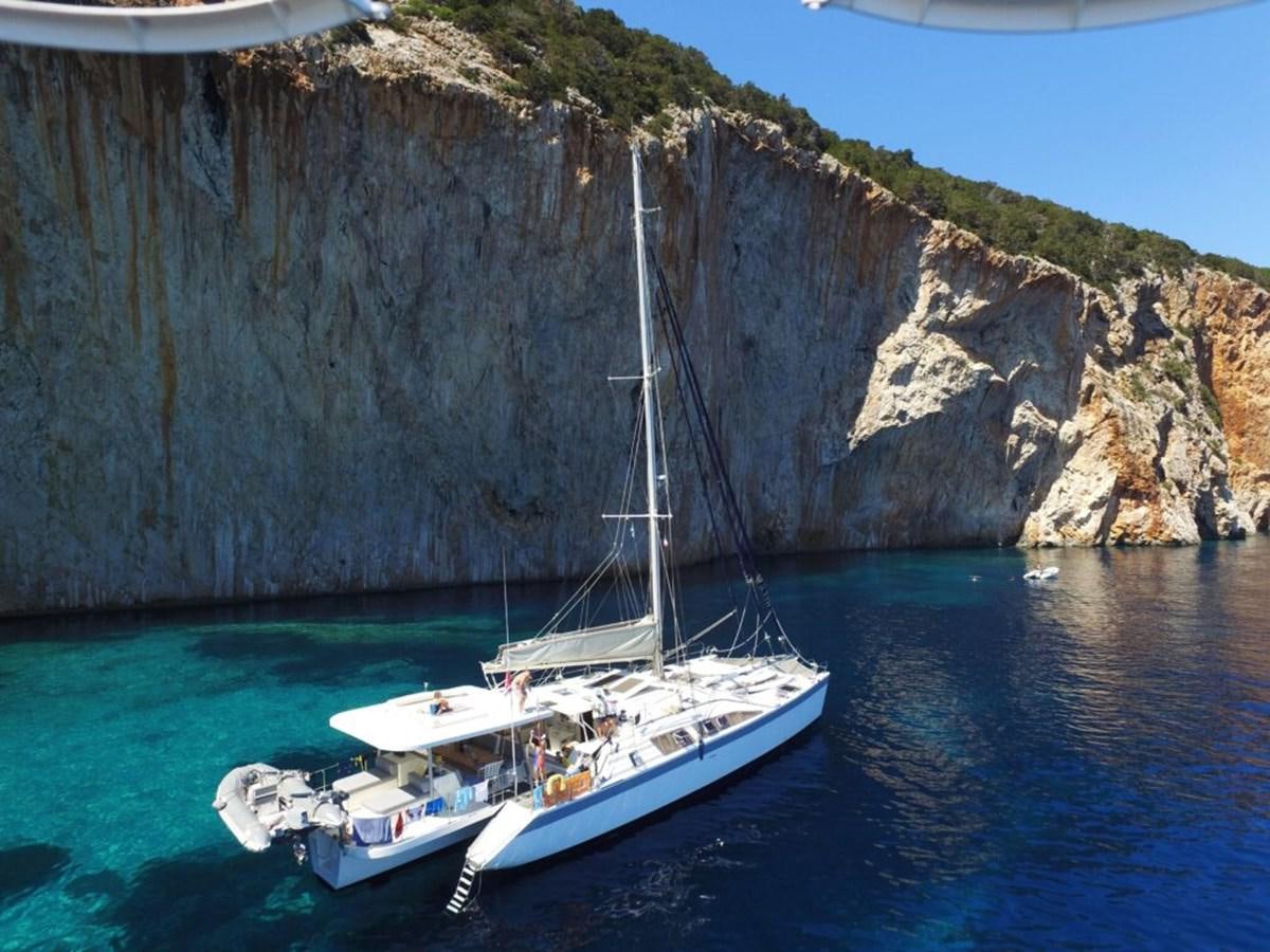 a boat sailing in the sea aboard CONAN Yacht for Sale