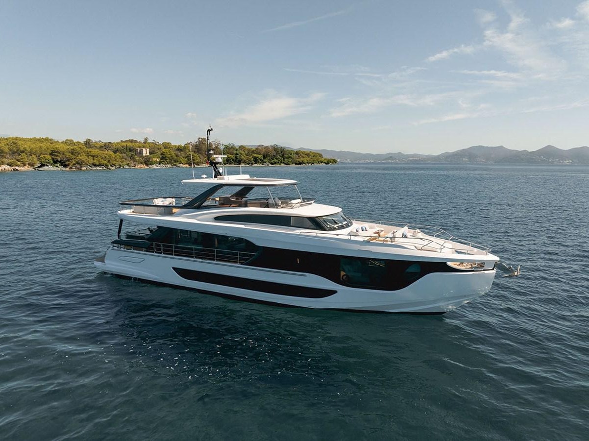 a white boat on water aboard AZIMUT GRANDE 26/25 Yacht for Sale